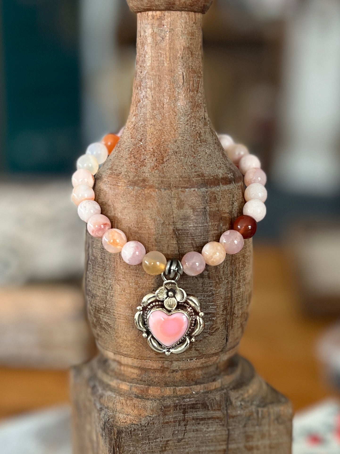 Tibetan silver Peruvian Opal heart charm on cherry blossom agates. Stretch stack bracelet. 7”.