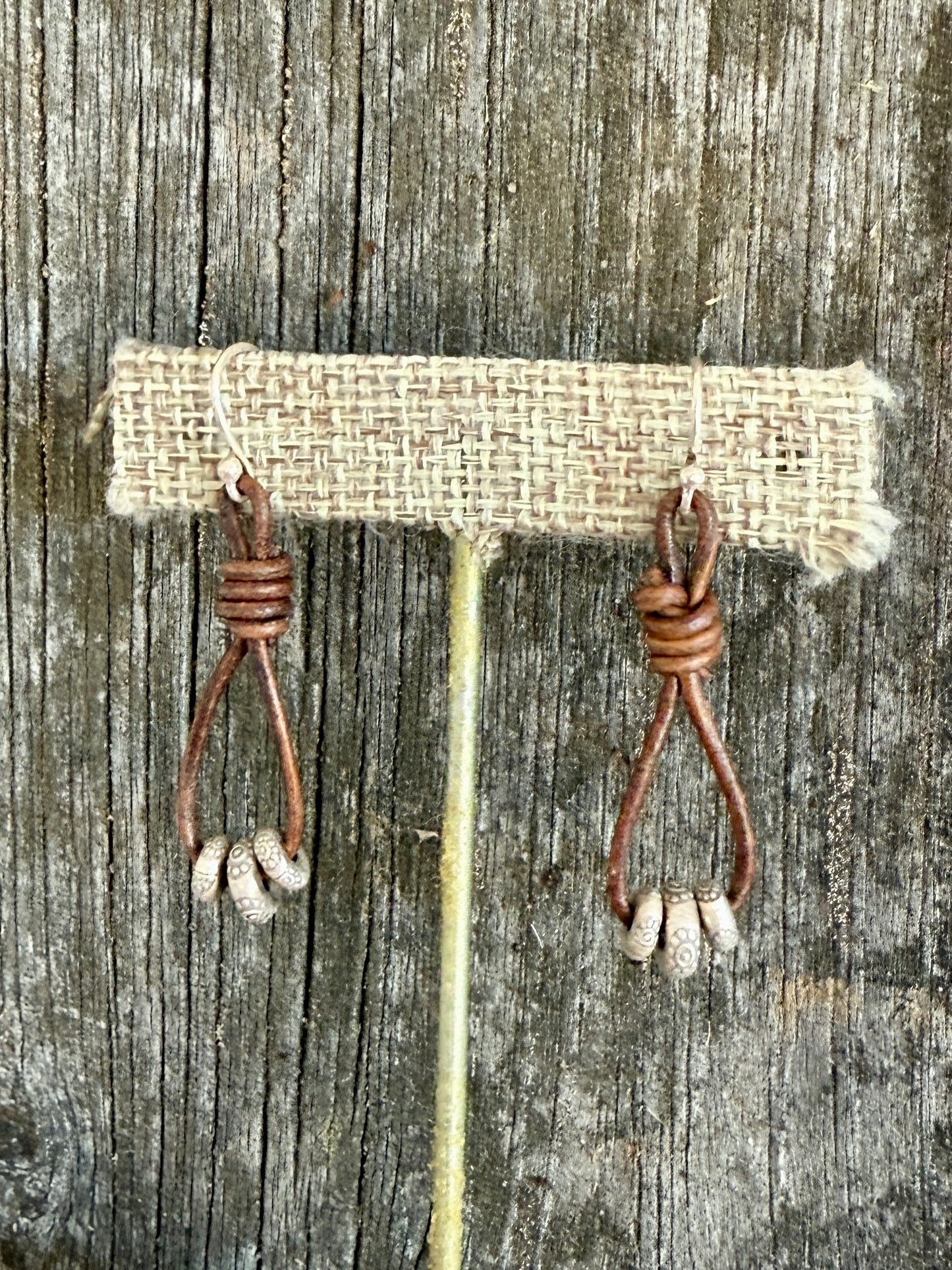 Leather and fine silver earrings.