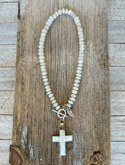Mother of pearl carved cross on faceted moonstone short necklace. 18”