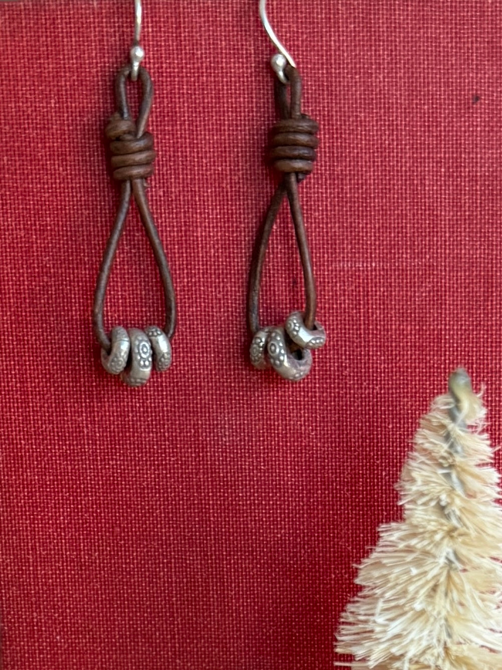 Leather and fine silver earrings.