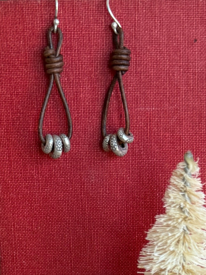 Leather and fine silver earrings.