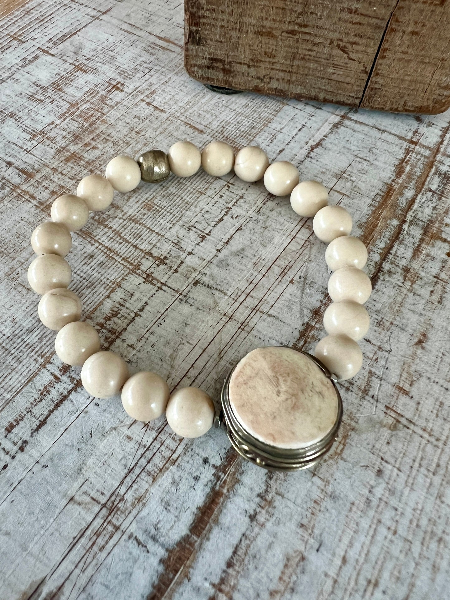 Tibetan bone focal bead with fossil jasper riverstone beads stretch stacker bracelet. 7”.