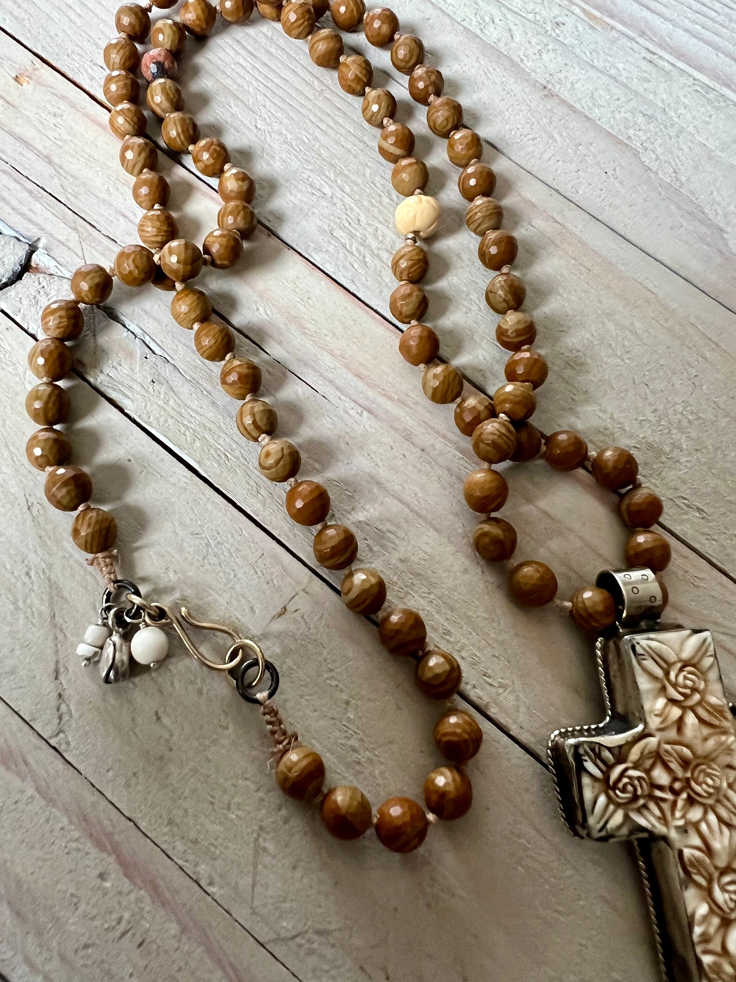 Carved Tibetan cross on wood agates, hand knotted long necklace.