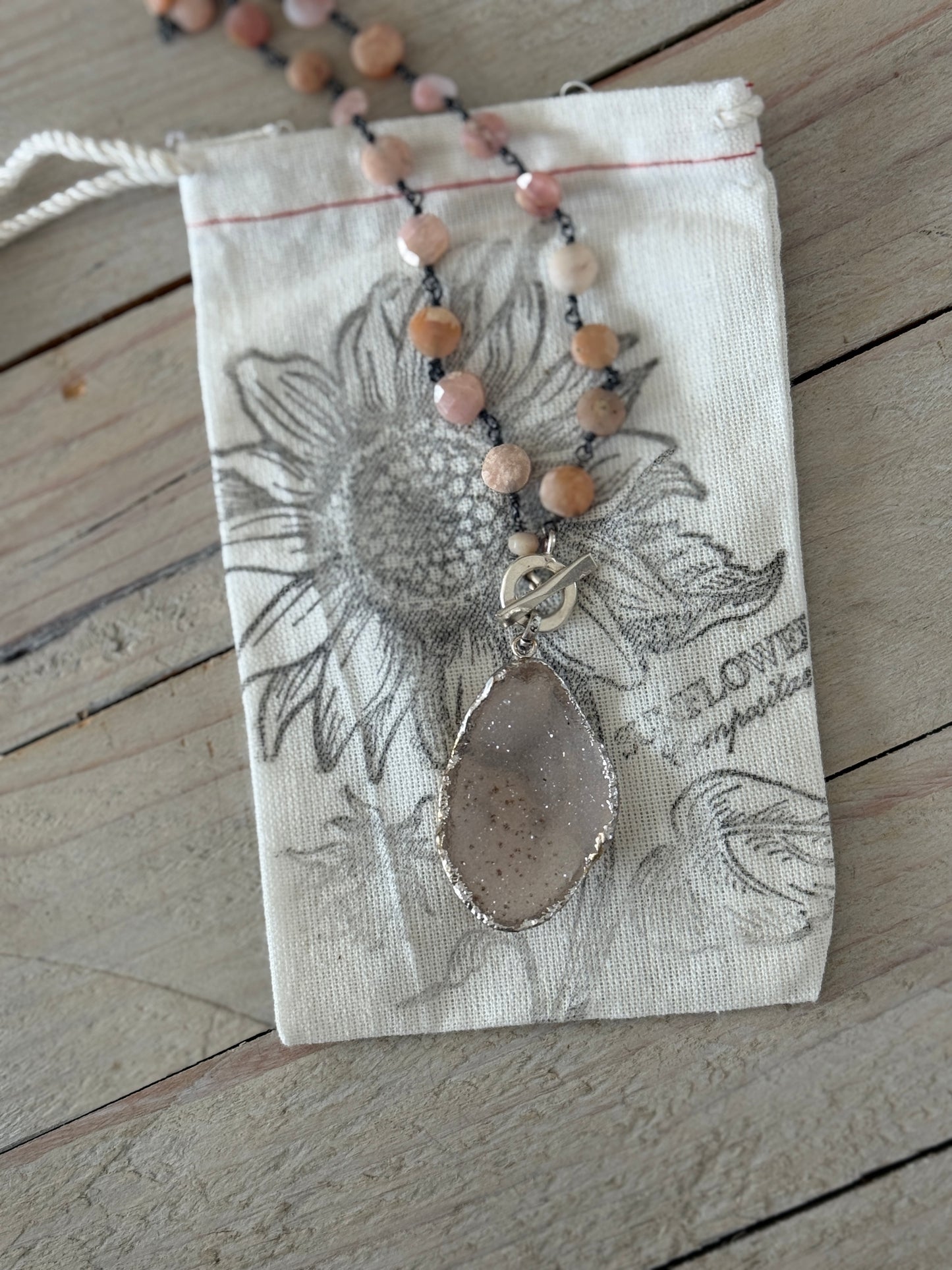 Pale pink druzie on pink Peruvian Opal wire-wrapped coins. Front fine silver toggle necklace.