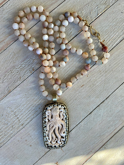 Carved bone octopus on hand-knotted druzy agates.  39” necklace. Wear long or short.