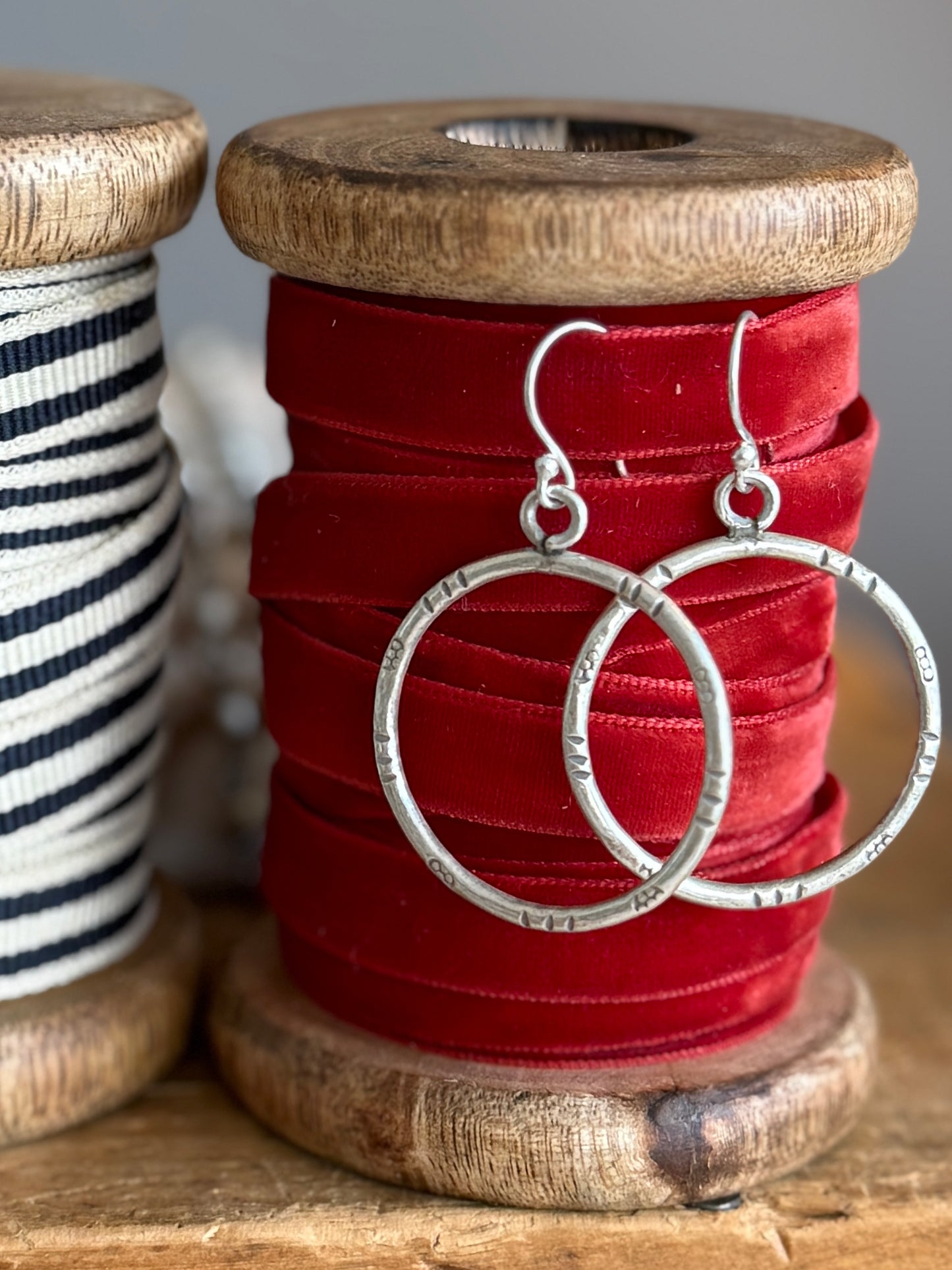 Stamped fine silver hoop earrings.