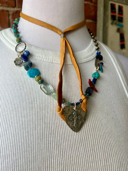 Sterling cross and heart pendant on a colorful assortment of gemstones. Adjustable necklace.