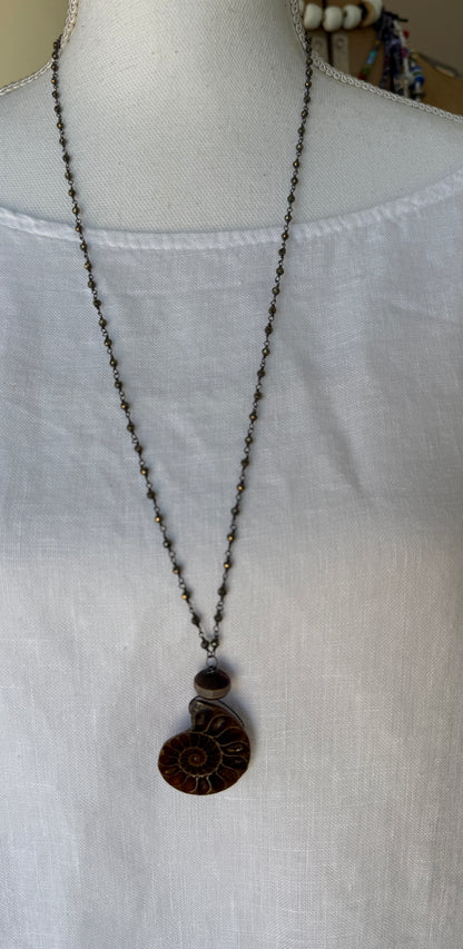 Natural ammonite fossil on pyrite chain necklace.