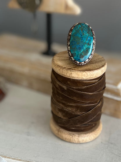 Large turquoise ring with blue and brown veins. Adjustable.