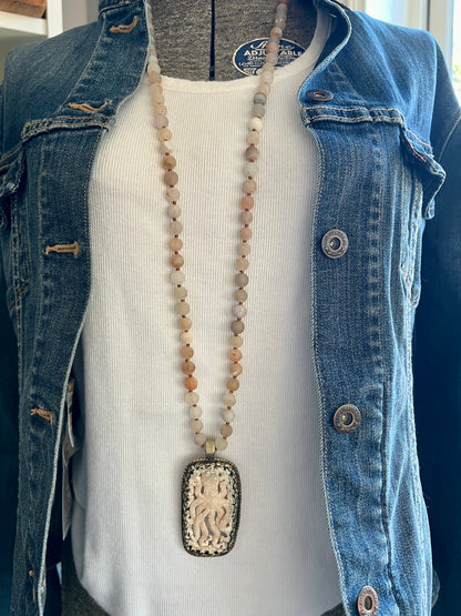 Carved bone octopus on hand-knotted druzy agates.  39” necklace. Wear long or short.