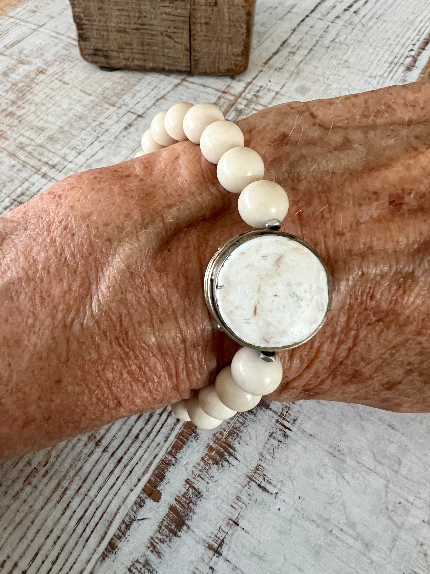 Tibetan bone focal bead with fossil jasper riverstone beads stretch stacker bracelet. 7”.