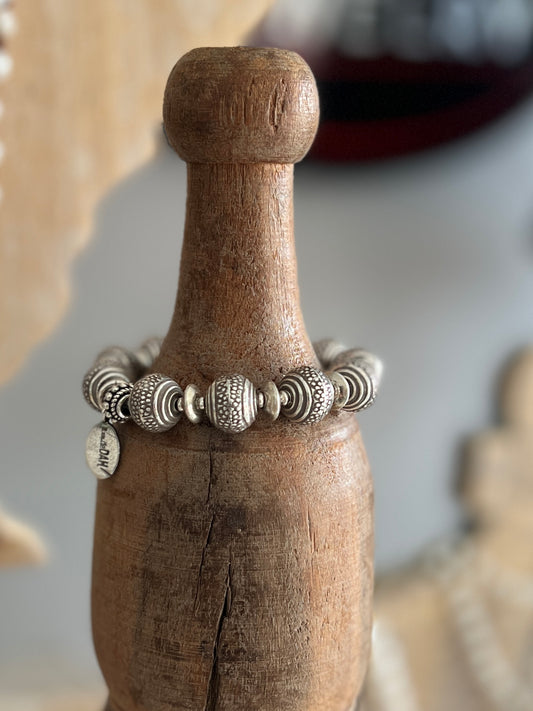 Fun, textured fine silver rounds stretch bracelet. Small (6”)