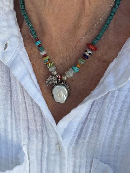 Pearl pendant on trade beads, moonstone, turquoise, coral, and fine silver accents necklace. 17.5”