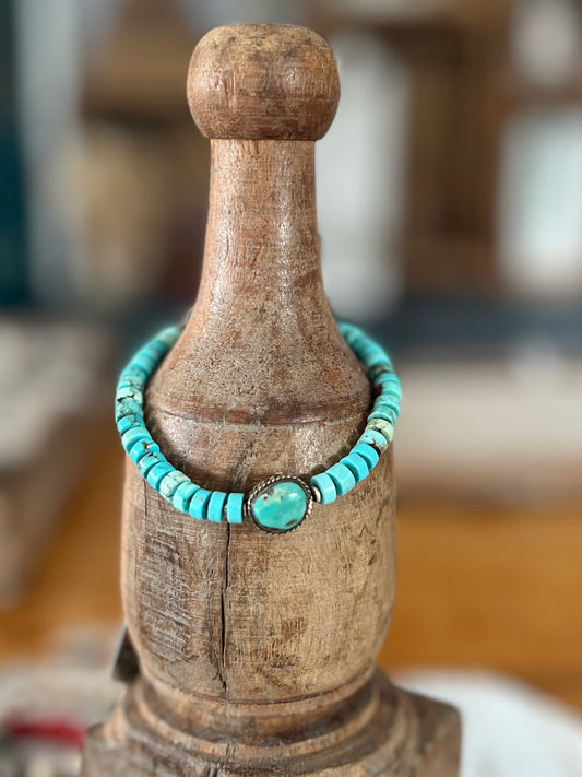 Old Tibetan turquoise focal with turquoise heishi beads. Adjustable bracelet 7-8.25”.