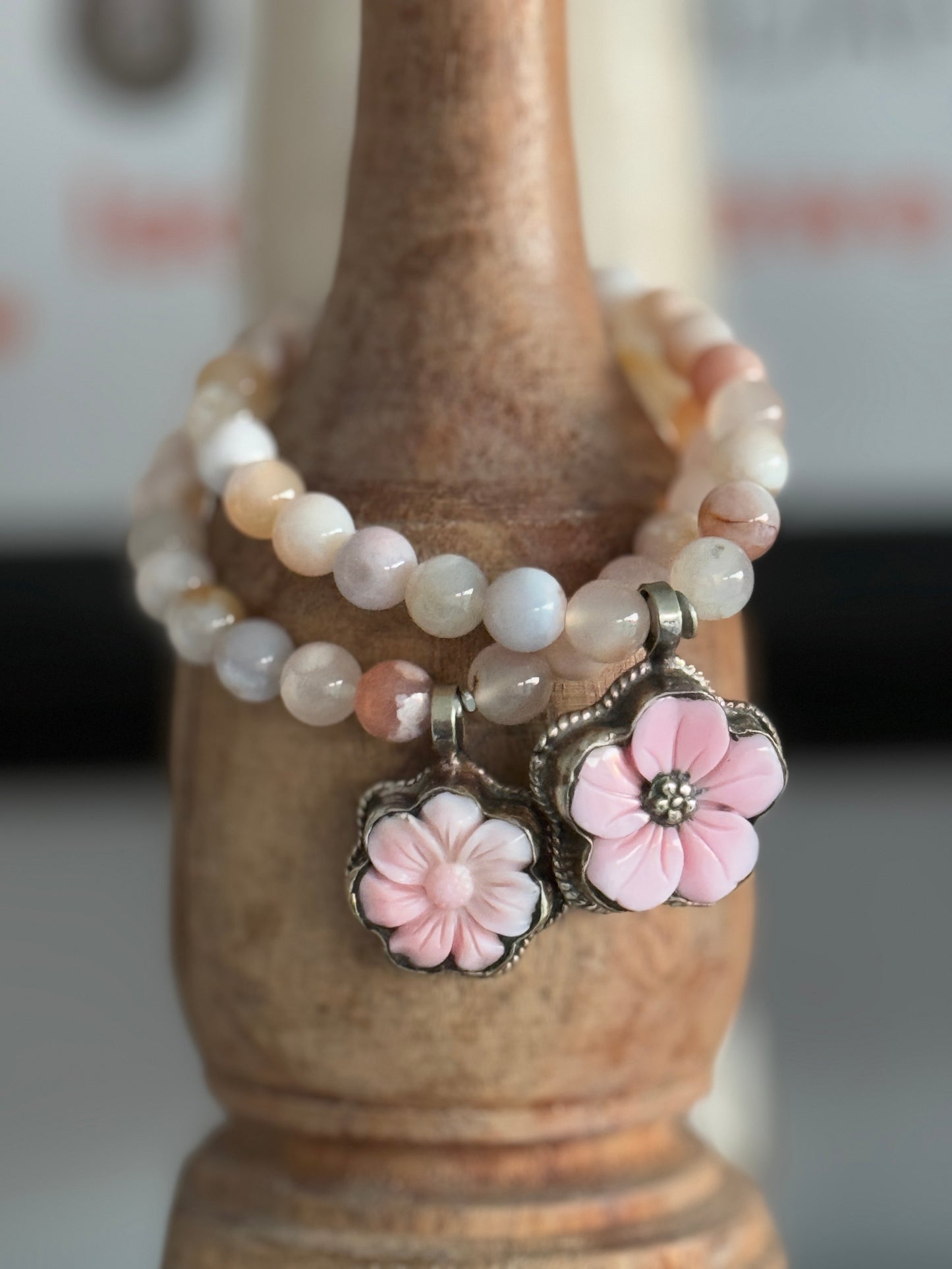 Tibetan carved Peruvian Opal charm on cherry blossom agate beads stretch bracelet. 6.5”