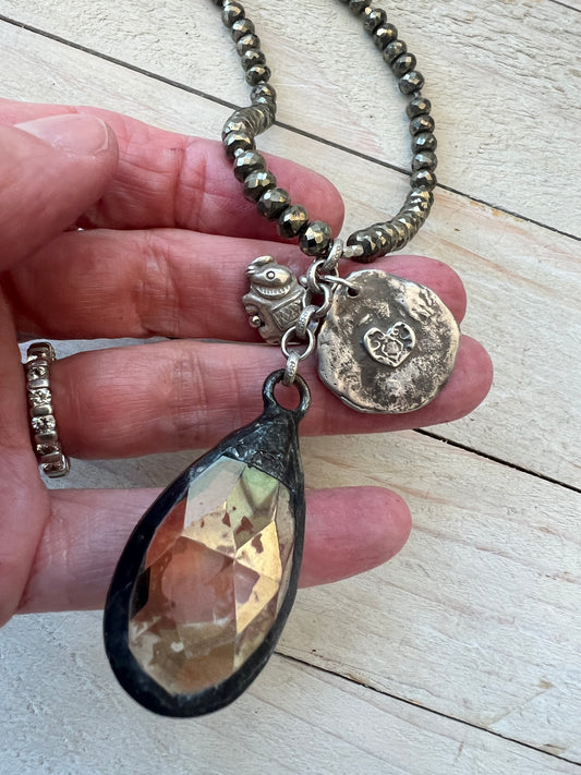 Crystal teardrop with fine silver elephant and sterling sitting buddha and heart pendant on pyrite adjustable necklace.