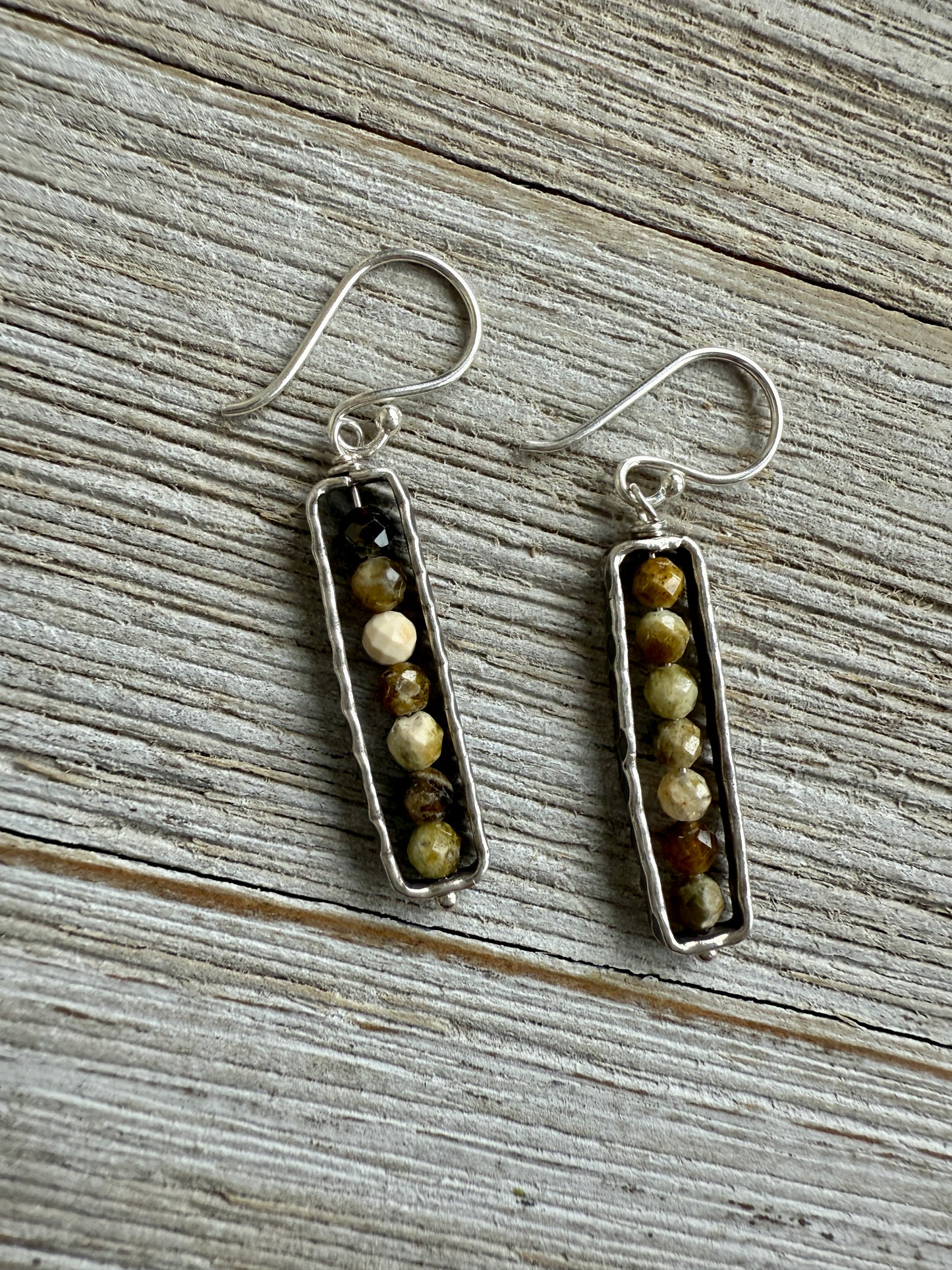 Green and gold serpentine in fine silver frames on fine silver ear wires. Earrings.