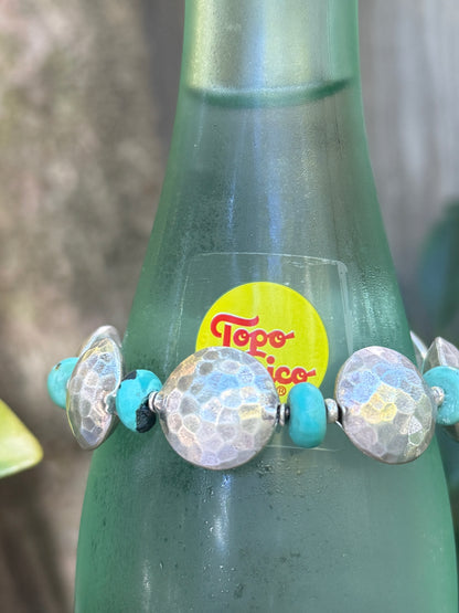 Hammered fine silver pillow coins with turquoise stretch bracelet. 6.5”
