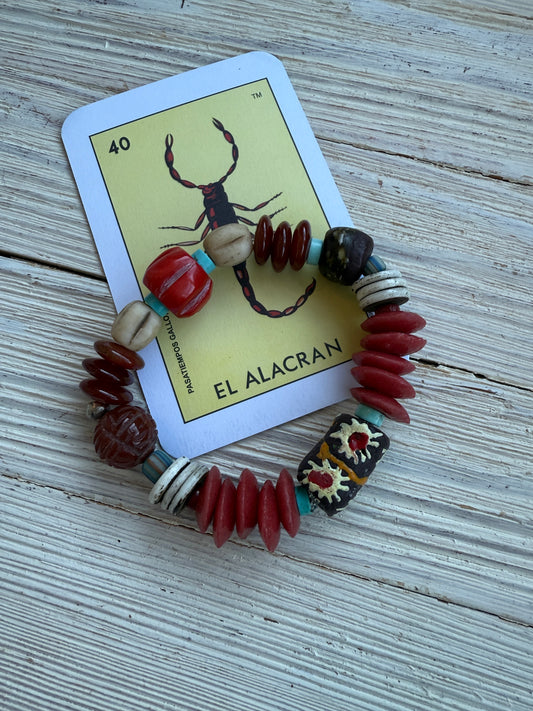 A mix of coral, turquoise, carnelian, glass, and trade beads bracelet. 6.5”