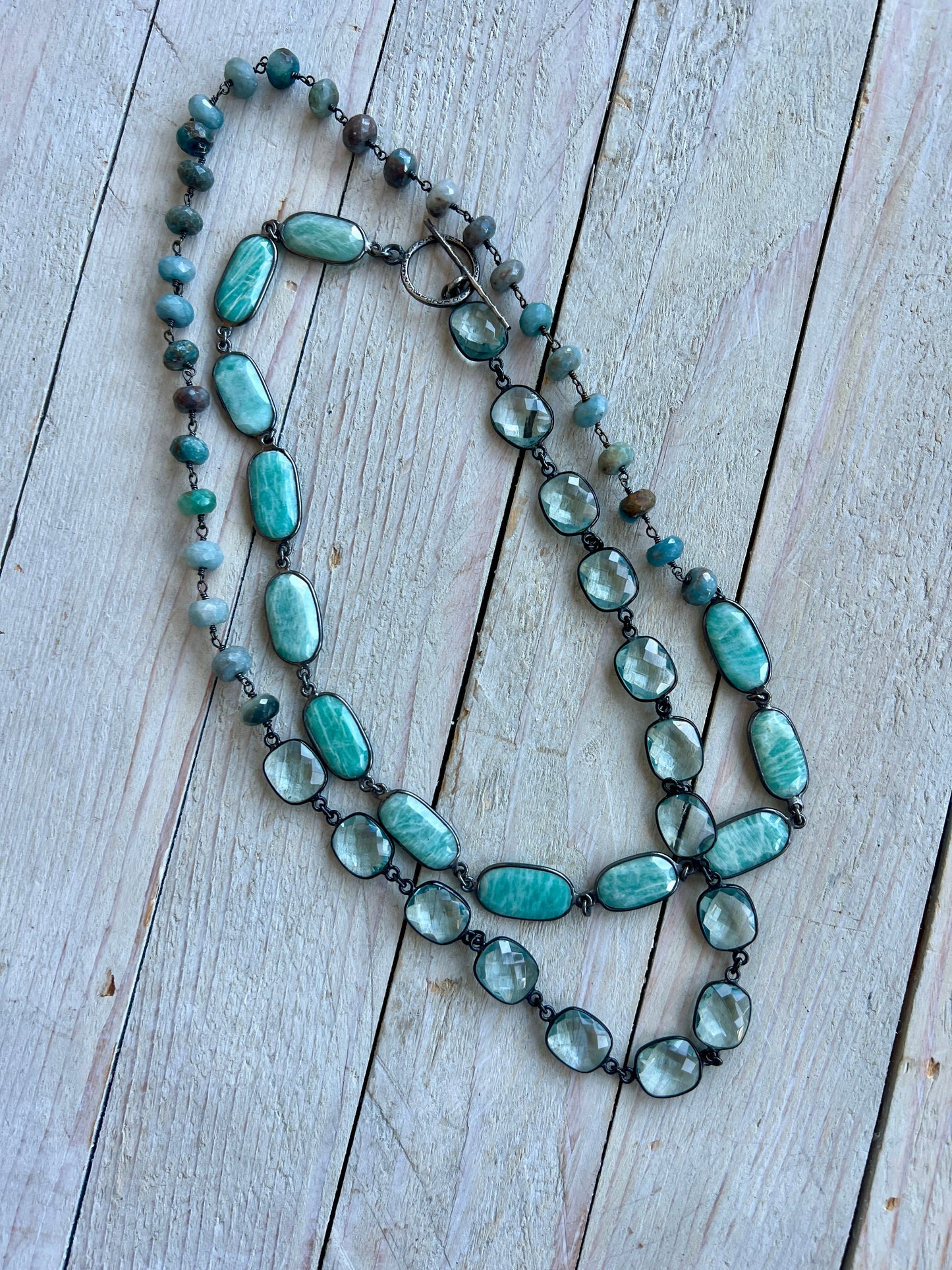 Beautiful aqua mix of green silverite, aqua crystal quartz, and Amazonite stones long necklace. 38”