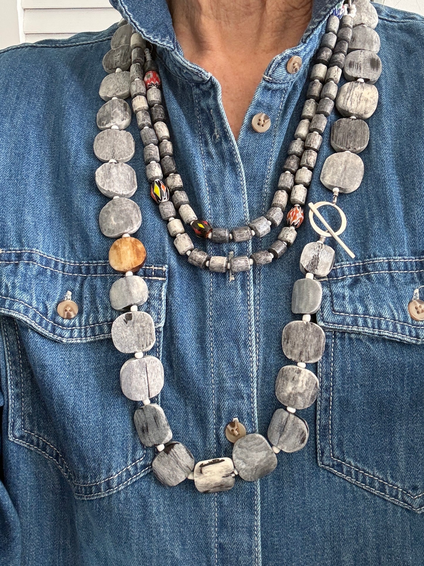 Dark grey bone coin long necklace with fine silver toggle. 35.75”