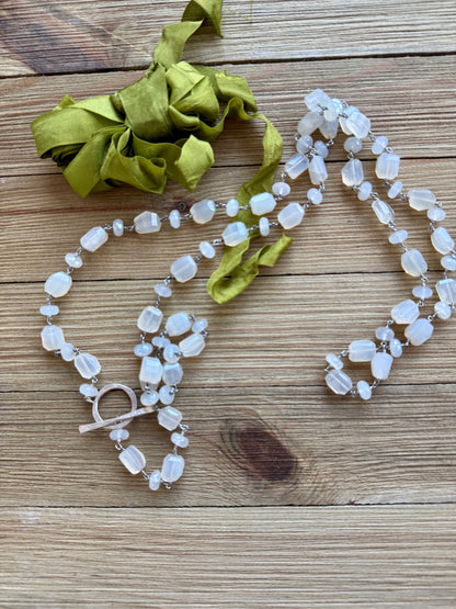 Milky white moonstone chain necklace. Oxidized sterling circle hinge clasp. 43” long.