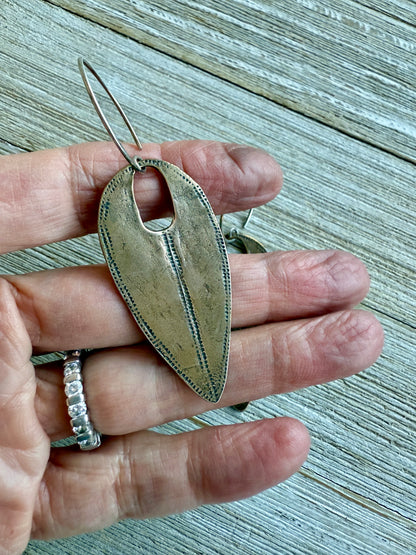 Handmade hammered bronze tribal earrings on pure silver ear wires.