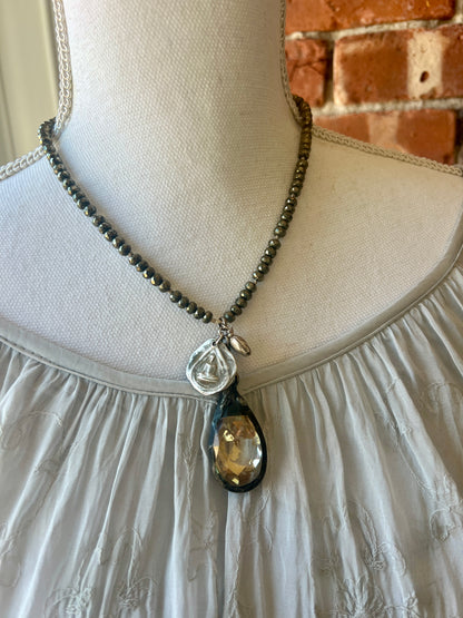 Crystal teardrop with fine silver elephant and sterling sitting buddha and heart pendant on pyrite adjustable necklace.