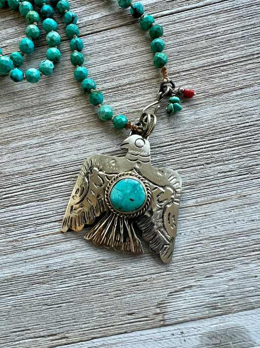 Thunderbird with turquoise hand-knotted long necklace. 32” long.