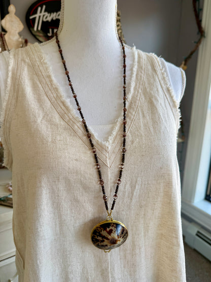 Limpet shell “purse” with chocolate pyrite, pearls, and Czech glass necklace. 