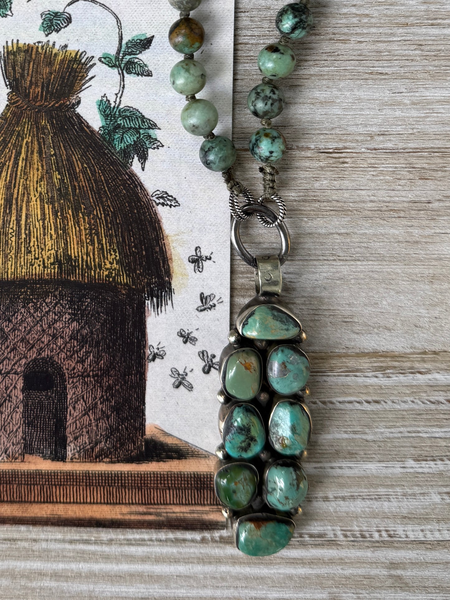 Green turquoise knotted necklace with Tibetan turquoise (removable) pendant. 34.25”.