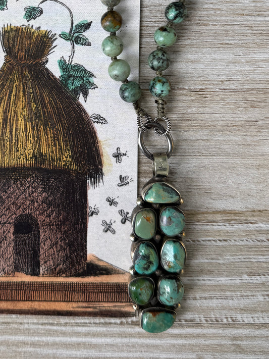 Green turquoise knotted necklace with Tibetan turquoise (removable) pendant. 34.25”.