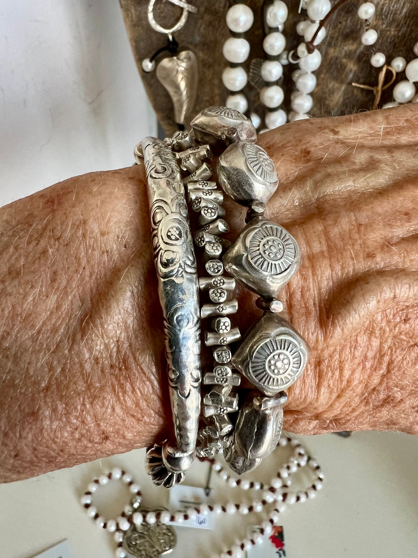 Stamped fine silver flower stretch bracelet.