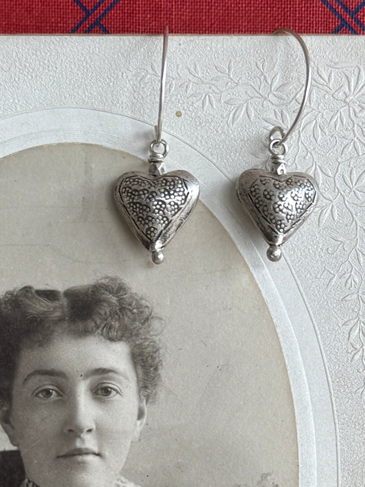 Stamped fine silver heart earrings.