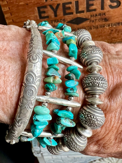 Fine silver bangle with stamped flowers. Bohemian stretch stacker bracelet.