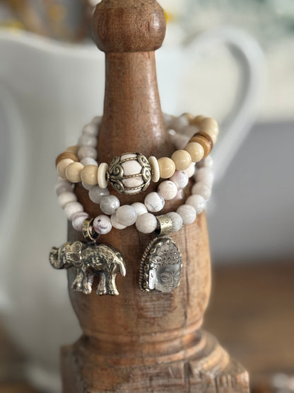 Tibetan bronze elephant on peach blossom agates stretch stack bracelet. 6.5”
