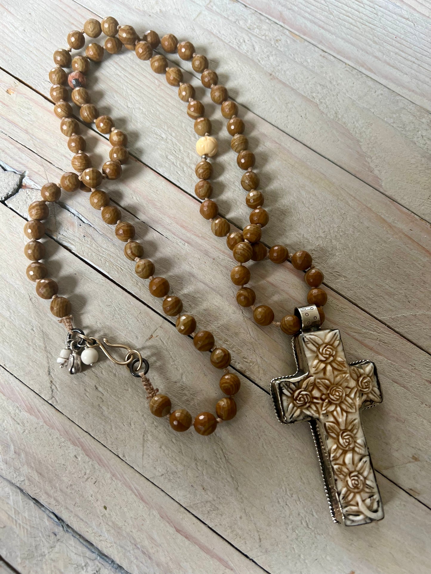 Carved Tibetan cross on wood agates, hand knotted long necklace.