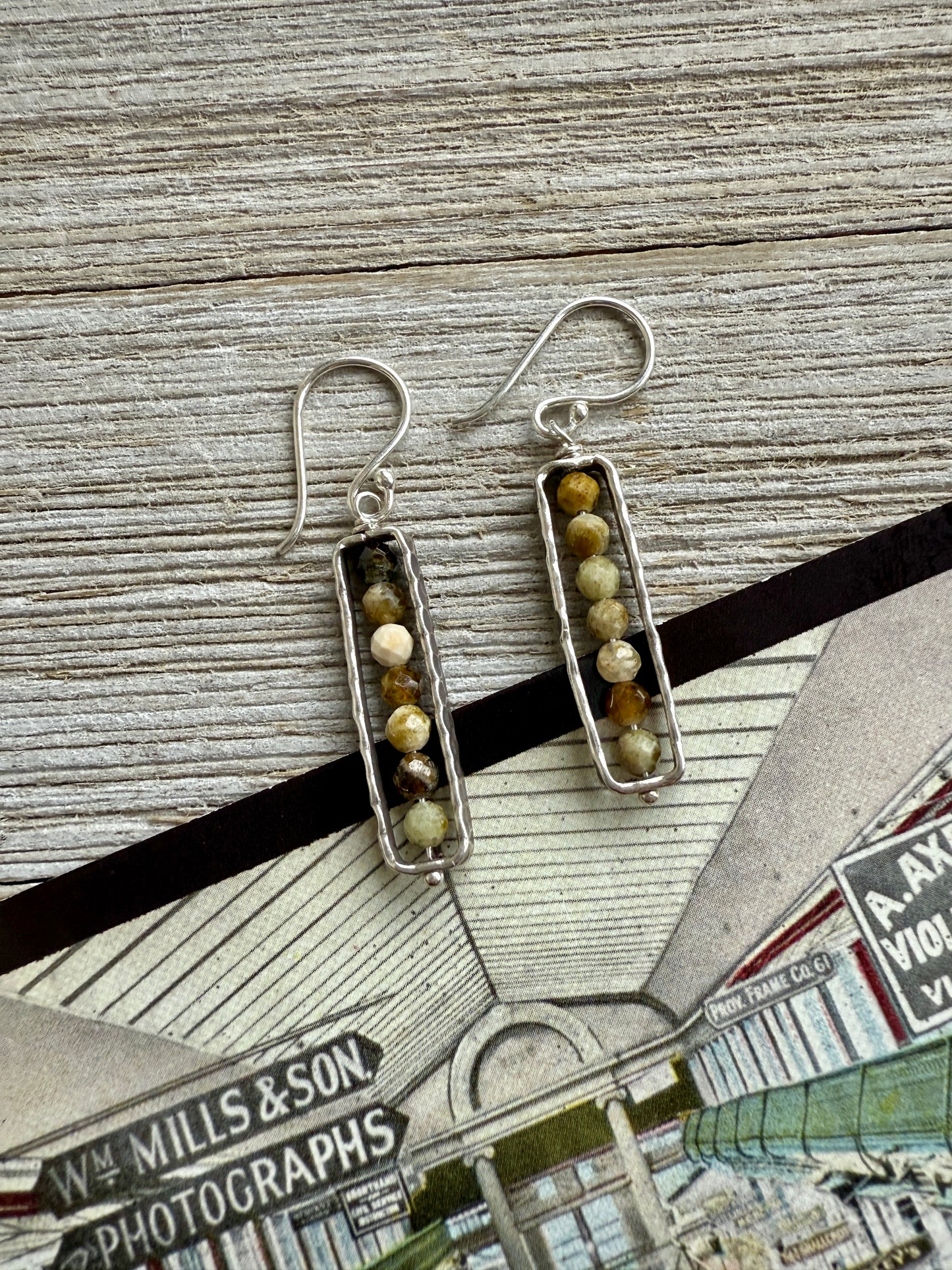 Green and gold serpentine in fine silver frames on fine silver ear wires. Earrings.