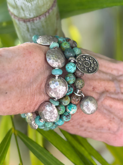 Hammered fine silver pillow coins with turquoise stretch bracelet. 6.5”