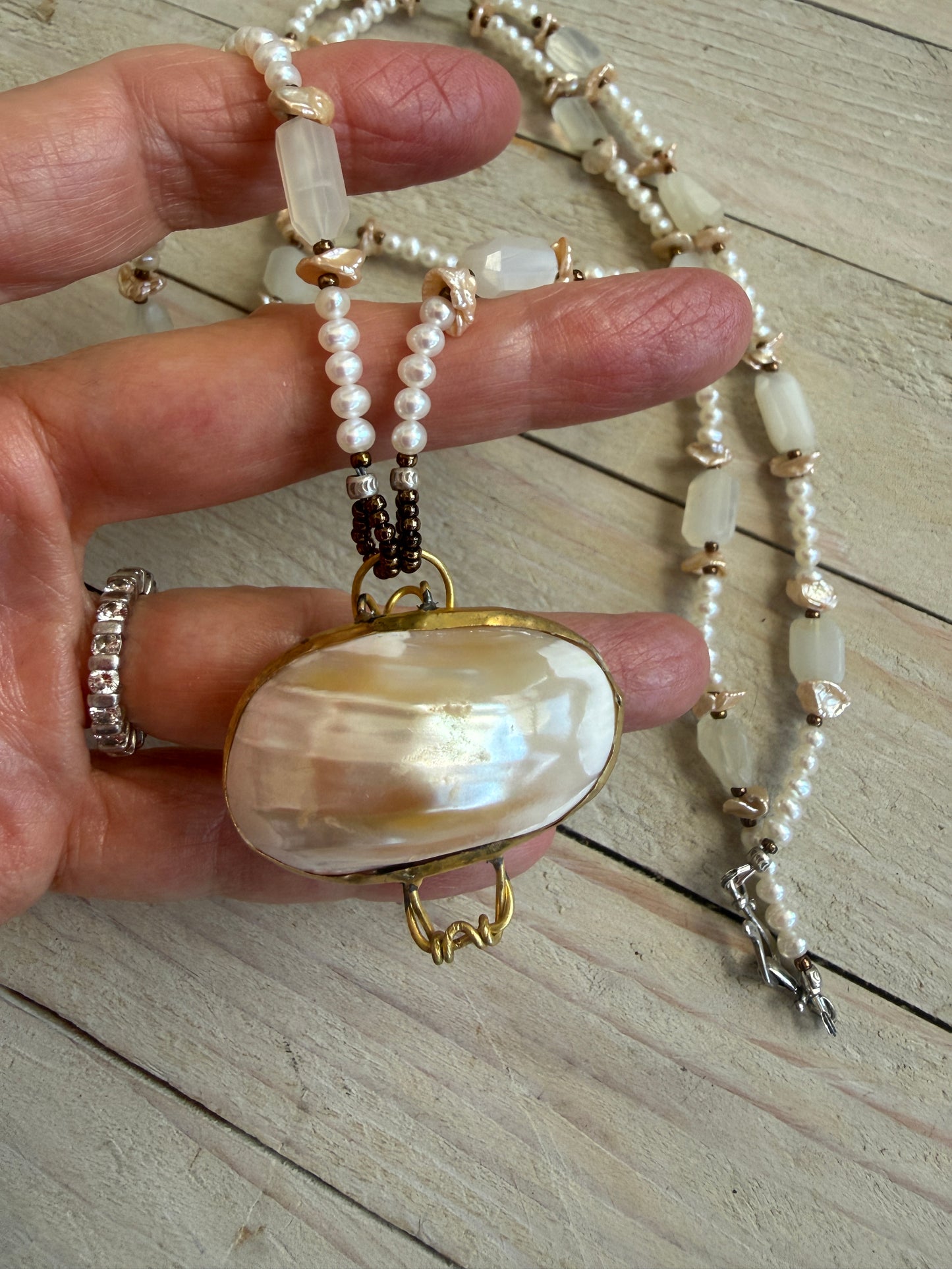 White shell pendant with moonstone and natural pearl necklace.