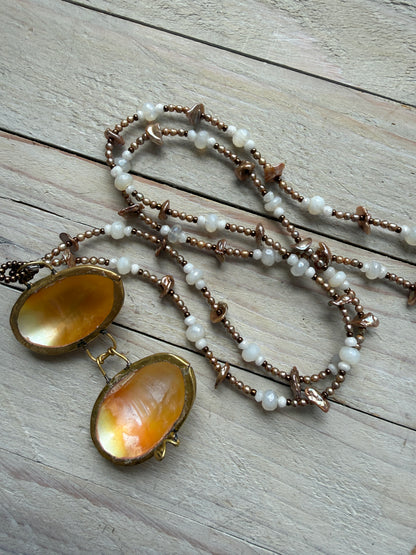A vintage handcrafted shell ring box pendant with champagne pearls and moonstone long necklace.