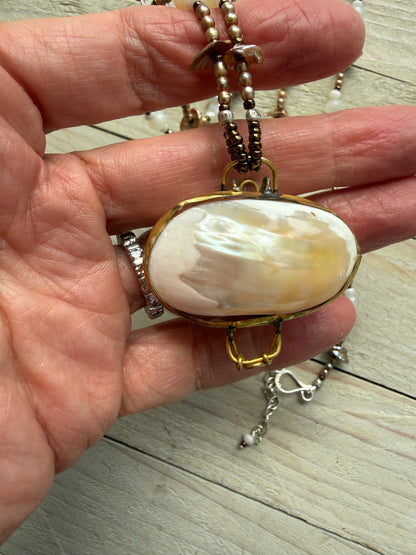 A vintage handcrafted shell ring box pendant with champagne pearls and moonstone long necklace.