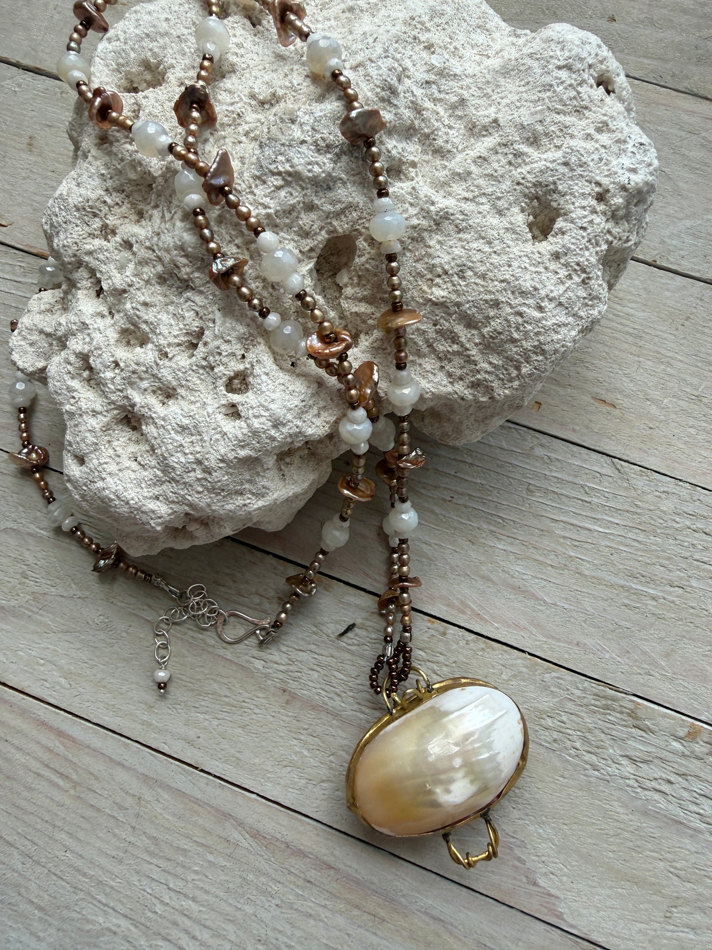 A vintage handcrafted shell ring box pendant with champagne pearls and moonstone long necklace.