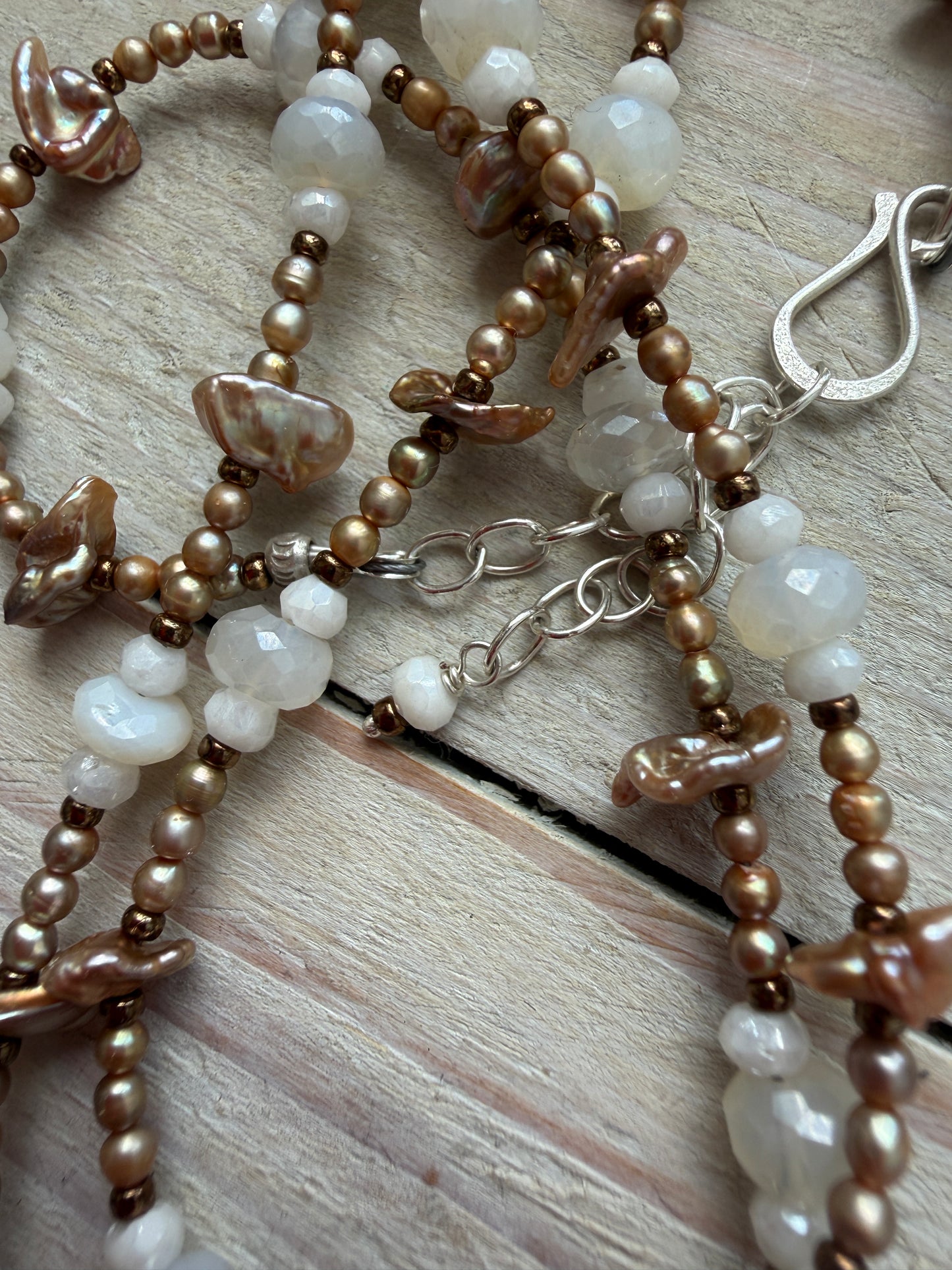 A vintage handcrafted shell ring box pendant with champagne pearls and moonstone long necklace.