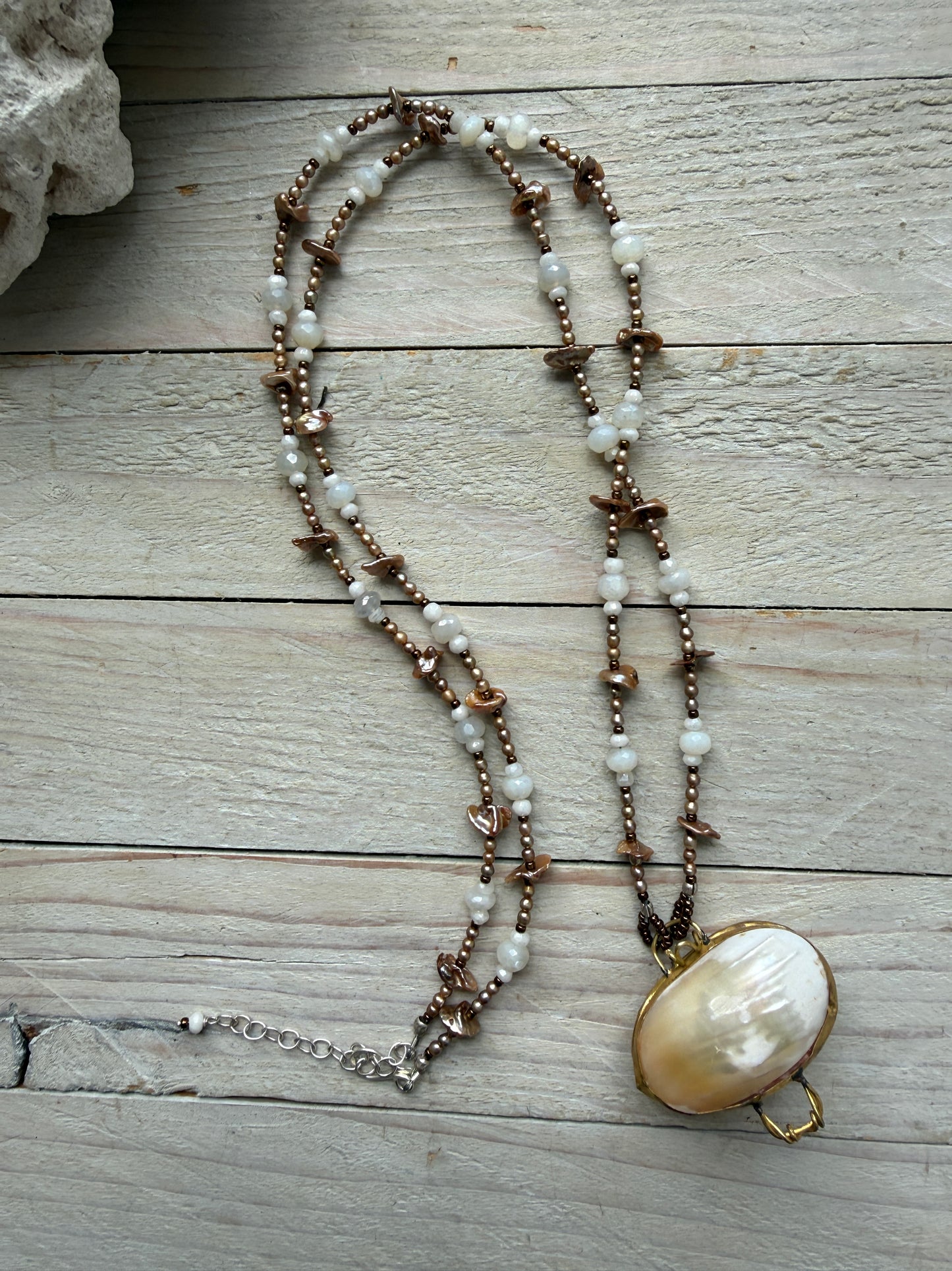 A vintage handcrafted shell ring box pendant with champagne pearls and moonstone long necklace.