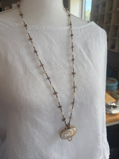 A vintage handcrafted shell ring box pendant with champagne pearls and moonstone long necklace.