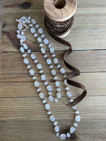 Milky white moonstone chain necklace. Oxidized sterling circle hinge clasp. 43” long.