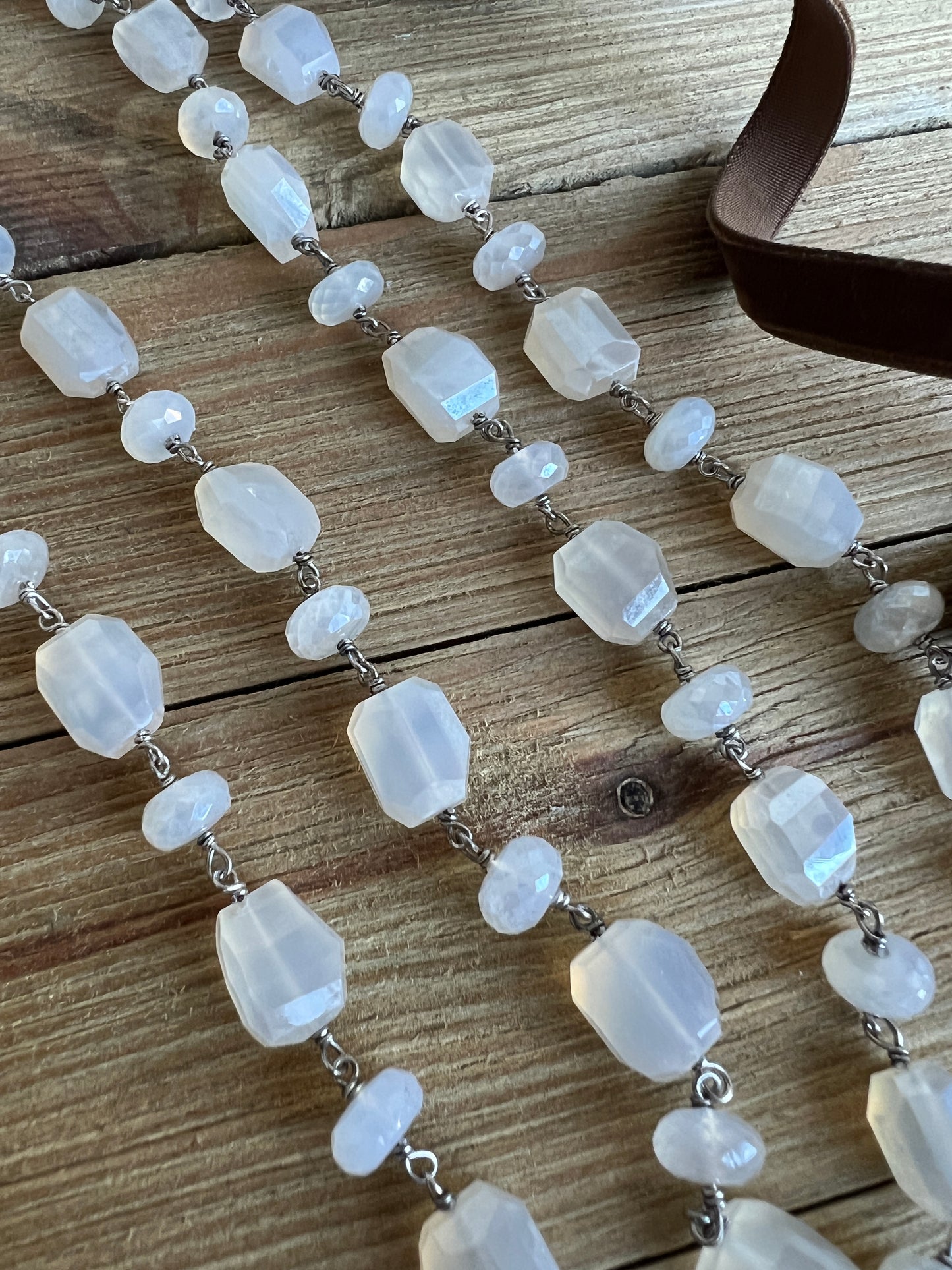 Milky white moonstone chain necklace. Oxidized sterling circle hinge clasp. 43” long.