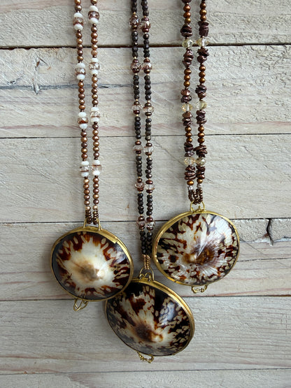 Shell “purse” on brown pearls and Czech glass necklace.