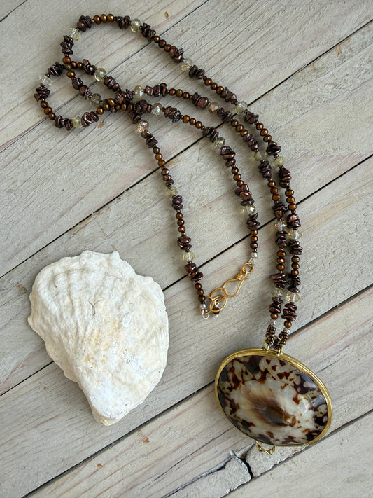 Shell “purse” on brown pearls and Czech glass necklace.